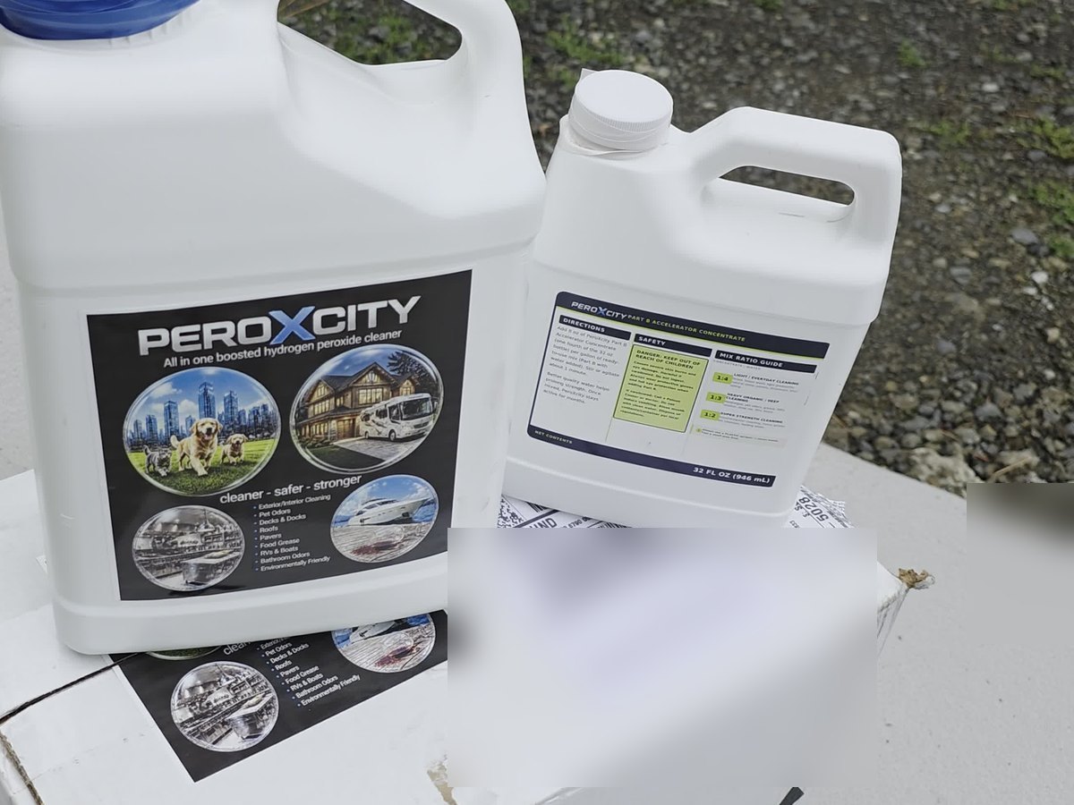 PeroXcity Concentrate Kit: 1-gallon Part A jug and 32 oz Part B Accelerator on the shipping box